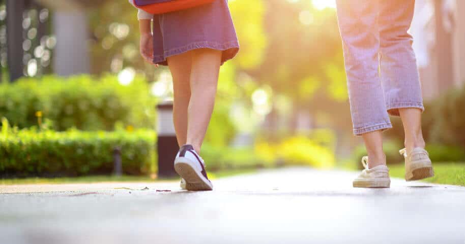 Woman walking with her child