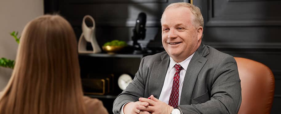 family law attorney Jonathan Breeden talking with client