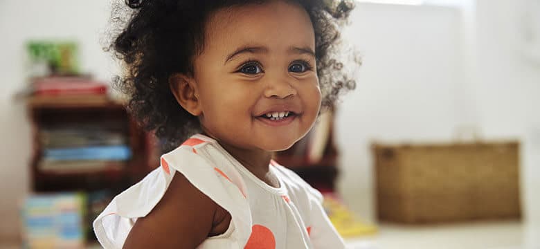 Young child smiling at camera