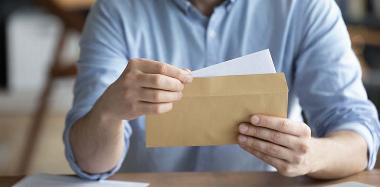 Man opening mail