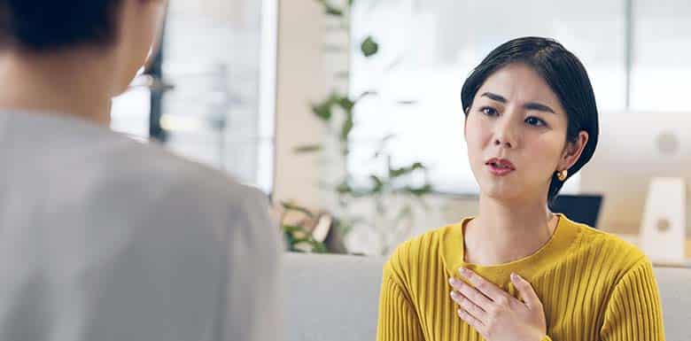 Woman speaking to man