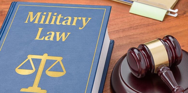 Military law book on table