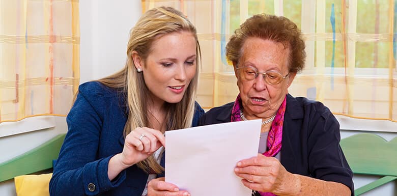 Older woman reviewing legal Will paperwork
