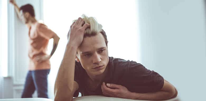 Same sex couple looking upset