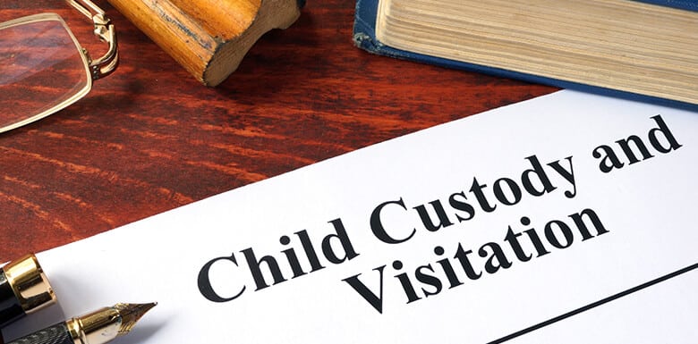 Child custody and visitation paperwork on a table