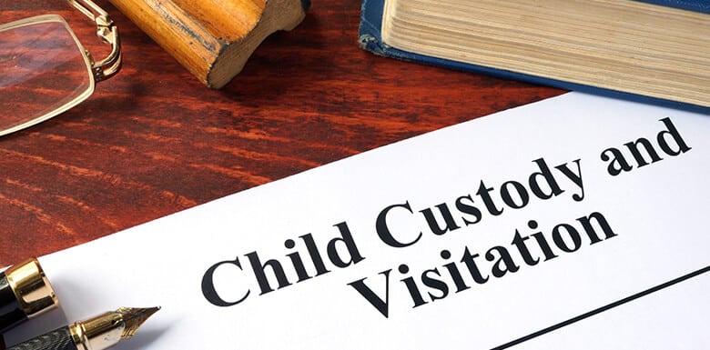 Child custody and visitation paperwork on desk