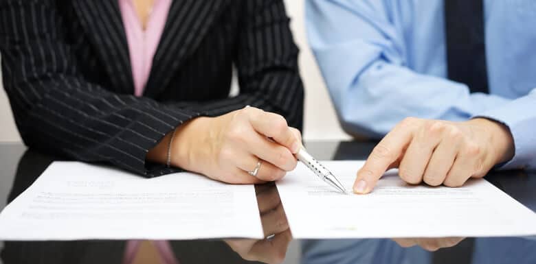 Man and woman reviewing legal docuemtns