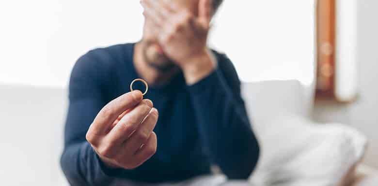 Man holding wedding band