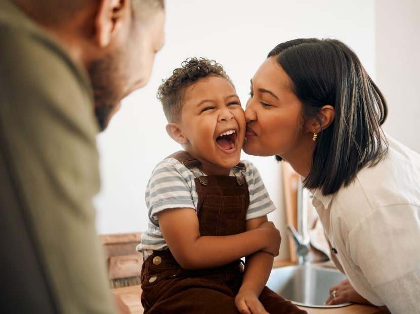 Parents excited with young child, adoption attorney