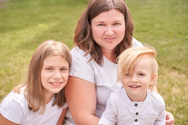 A Wake County mother sits with her children after defending her custody rights in NC.